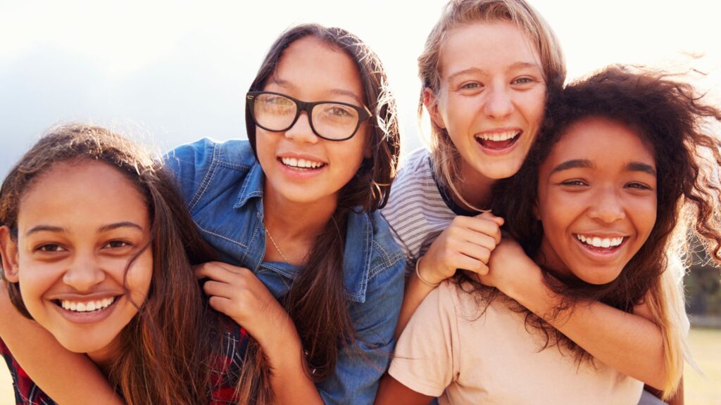 teens take a selfie and talk about the invisalign process step by step
