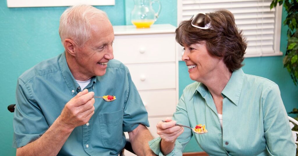 a senior couple enjoys breakfast together and wonder "Is 70 too old for braces"