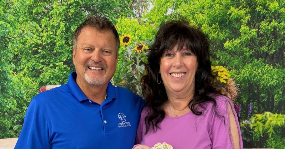 adult smiles after using payment plan for braces